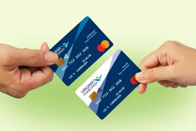 Hands hold two Virginia Credit Union Mastercard credit cards — a cash rewards card and a flex rewards card — in front of a gradient green background.