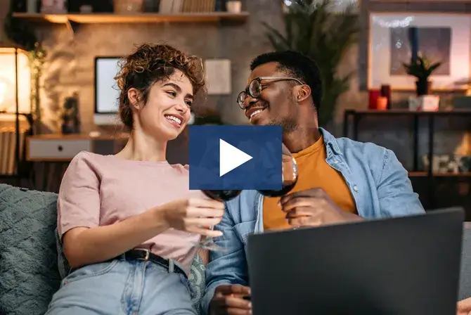couple enjoying glass of wine on the couch