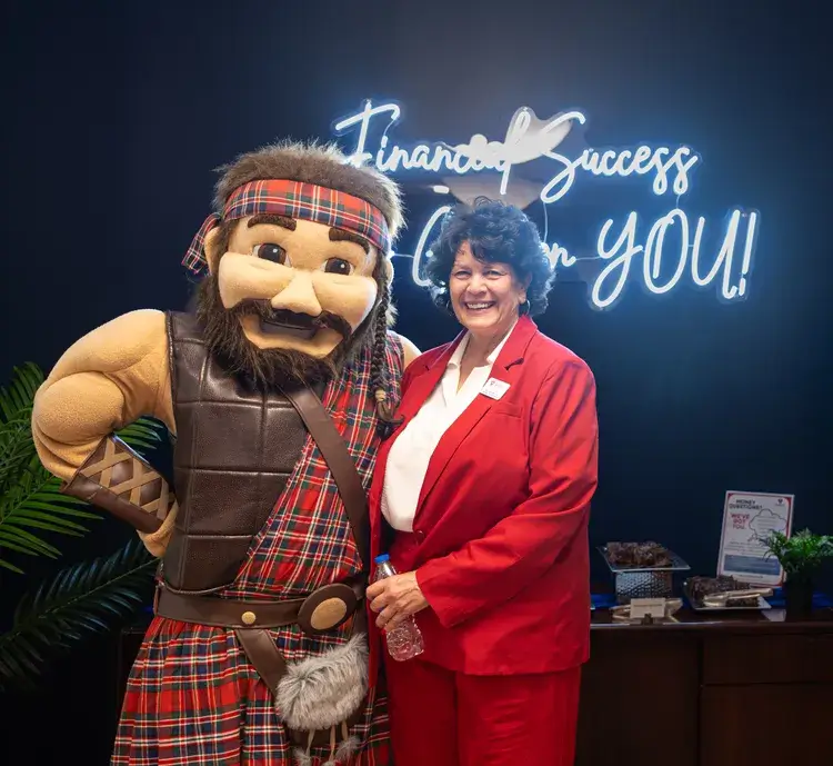 Gayle Evezich, Executive Director of the Financial Success Center and Radford University mascot