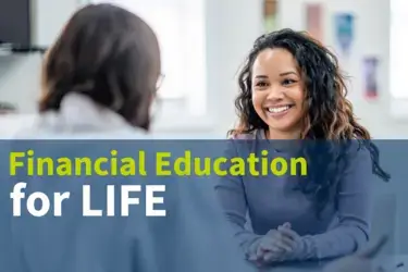 Young woman smiling while attending a one-on-one meeting
