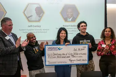 VACU presents check for VCU's Developing Men of Color initiative 
