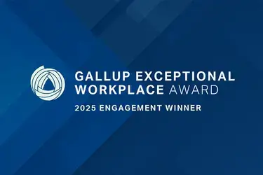 Blue graphic with overlaid text that reads "Gallup Exceptional Workplace Award 2025 Engagement Winner"