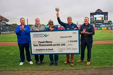 VACU presenting check to Feed More for Strike Out Hunger partnership