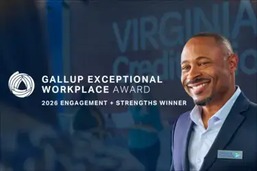 VACU employee smiling with blue background and text overlay "Gallup Exceptional Workplace Award"