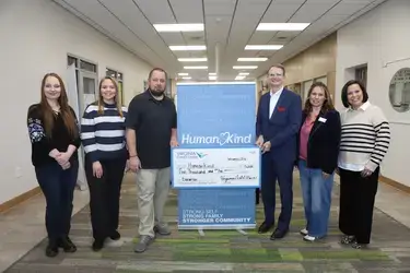 VACU presenting donation to Human Kind