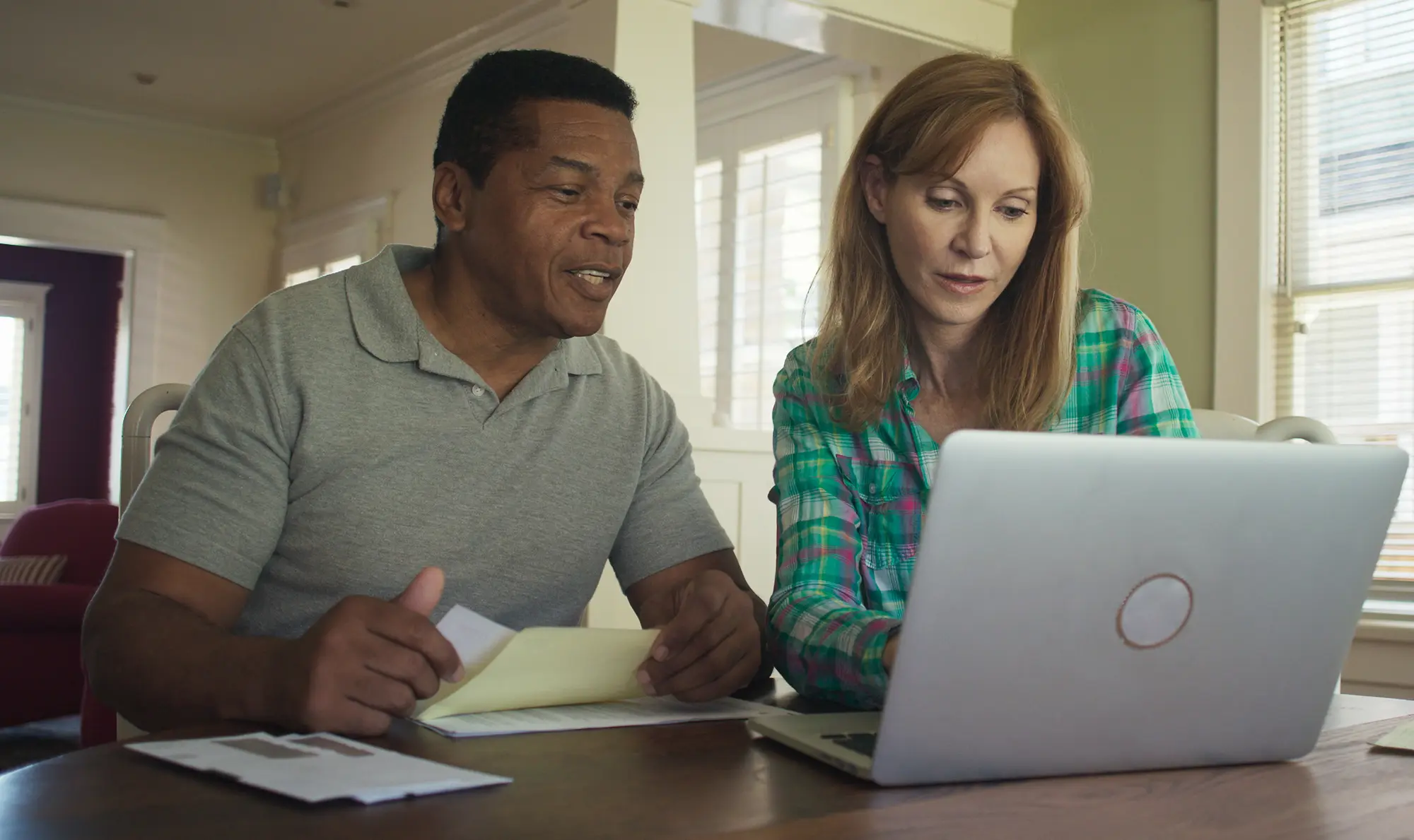 Adobe Stock 309014939 Mature Husband and Wife using laptop computer to go over home budget copy