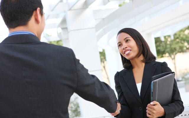 Professional woman shakes bosss hand 978b8d064138018a1dfad71b9882dd21