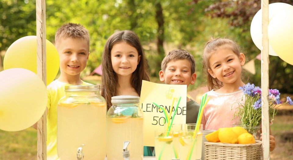 Children work together at lemonade stand 978b8d064138018a1dfad71b9882dd21