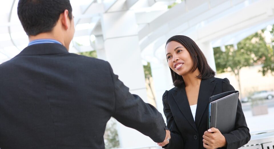 Professional woman shakes bosss hand 978b8d064138018a1dfad71b9882dd21